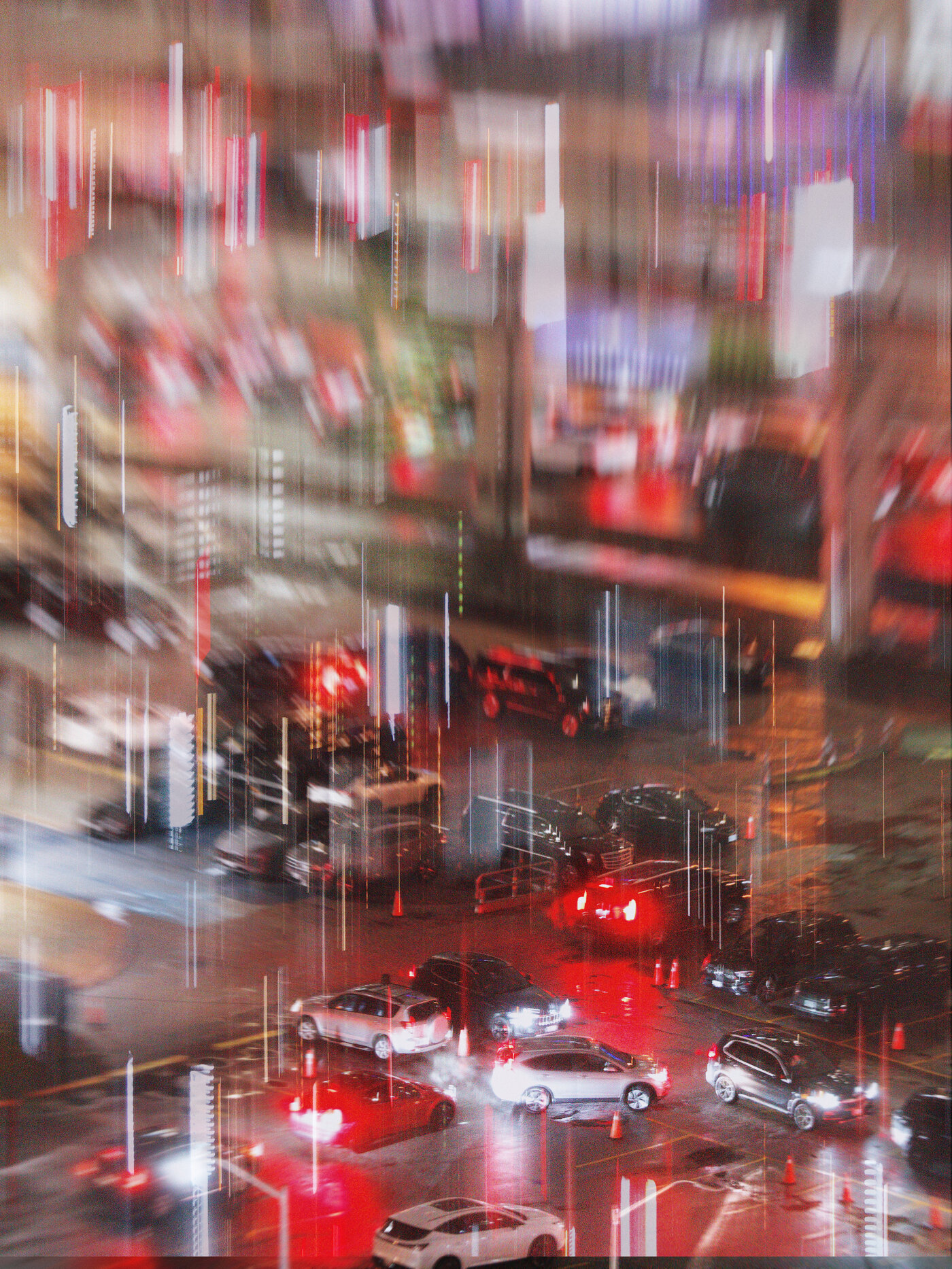 A night intersection shot from above with heavy vertical camera movement, so the whole frame appears to rain downward in thin streaks of white, red and amber light. Below the streaks, cars cross a wet, red-lit junction - a white SUV and a silver sedan mid-turn, headlights and tail lights smeared into the reflections on the soaked asphalt.